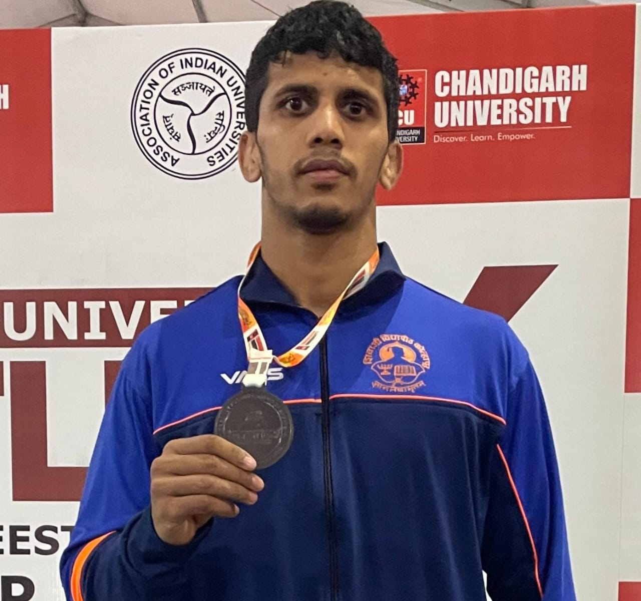 Omkar Patil of Shahaji College wins bronze medal in All India Inter University Wrestling Championship